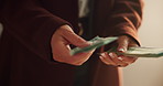Hands, fraud or woman counting cash for profit, money laundering or investment scam in crime syndicate. Closeup, bank notes or thief with dollars in criminal activity, corruption or illegal business