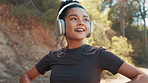 Fitness, music and woman with headphones in nature for wellness, health and active in morning. Sports, runner and happy person streaming audio, radio or podcast for exercise, training and workout
