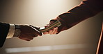 People, bribery or hands with payment for deal, money laundering or settlement in crime syndicate. White background, studio or fraud with bribe exchange in corruption, dollars or illegal business