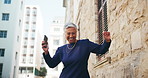 Smile, woman and dance with earphones in city for listening to music, streaming audio and travel fun. Mature person, rhythm and moving with energy for playlist, morning commute and freedom of journey