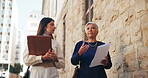 Conversation, documents and walking with lawyer women outdoor in city for court case preparation. Paper, talking and teamwork with advocate people in urban town for discussion of legal trial