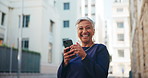 Mature woman, happy face and city with phone for app, online connection or communication. Portrait, female person or wink with smile on mobile smartphone for network, chat or texting in an urban town