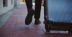 Legs, luggage and walking with business person in city for commute or travel from back. Feet, sidewalk and suitcase with corporate employee outdoor in urban town for international journey or trip