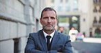 Serious, face and mature businessman in city with confidence for entrepreneurship with ambition. Professional, portrait and financial executive from Australia with pride for company growth in town.