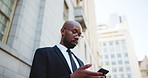 Business, waiting and black man in city, cellphone and decision with app for location, luggage and travel. African person, employee and consultant in street, commute or smartphone for car service