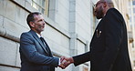 Handshake, welcome and business men in city for investment agreement, partnership or meeting. Introduction, teamwork and finance banker shaking hands with investor for contract, thank you or greeting