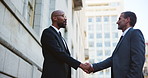 Shaking hands, deal and business men in city for investment agreement, partnership or meeting. Welcome, handshake and finance banker with investor for contract, thank you or greeting in urban town.