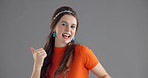 Face, happy woman and dancing in studio for freedom, celebration and energy on gray background. Excited person, moving and dancer with rhythm for groovy music, fun party or carefree with thumbs up