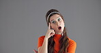 Face, thinking and woman with surprise in studio for idea, planning and solution for announcement. Portrait, shocked and person pointing for thoughts, decision and problem solving on gray background
