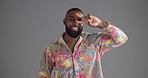 Happy man, funny dancer and face in studio for comedy, humor or moves on a gray background. Portrait, male person or model dancing with comedy or fun expression for comic, fashion style or groove