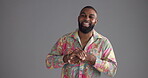 Black man, face and laughing with fashion in studio for bold indie style, bohemian aesthetic and confidence. Mockup space, person and happy in paisley shirt with attitude and pride on gray background