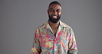 Happy, black man or face with fashion in studio for clothing style on a gray background. Portrait, male person or hipster model with smile, beard or stylish tshirt for creative design on mockup space