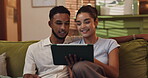 Browsing, watching and couple with tablet, date and bonding with entertainment, online and living room. House, streaming and people with tech for film, woman and man in lounge, chilling or apartment