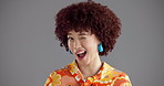 Wink, happy and face of woman in studio for happiness, confident and retro fashion. Mockup space, confidence and portrait of person with emoji, gesture and flirt in trendy clothes on gray background