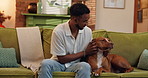 Bonding, relax and man with dog on sofa with connection for adoption in living room at apartment. Happy, playing and male person rub puppy, pet or animal for love, care or companionship in home.