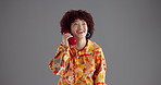 Retro telephone, fashion and woman in studio, smile and stylish clothes on gray background. Mockup space, happy person and model with communication, calling and vintage outfit with discussion and joy