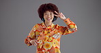 Face, dancing and happy woman in studio, fashion and confident personality on gray background. Portrait, person and dancer with smile, model and trendy clothes with stylish outfit, joyful or movement