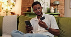 Man, smartphone and credit card for ecommerce in home, relax on sofa with online shopping or subscription payment. Mobile app, banking or fintech for happy male consumer with web store discount