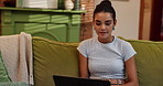 Laptop, relax and smile with woman on sofa in living room of home for education or distance learning. Computer, development and research with college or university student in apartment for study