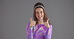 Face, retro or happy girl with thumbs up in studio for clothes space, trendy style or silly personality. Yes, woman or smile with hand gesture, fashion review or vintage outfit on grey background