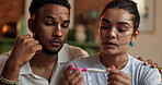 Home, angry and couple with pregnancy test, depression or infertility with crisis. Apartment, man or woman with negative results, sad or fertility problem with support, IVF or frustrated with anxiety