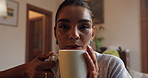 Relax, drinking and face of woman with coffee in home with calm, peace and morning on weekend. Cappuccino, mug and portrait of female person enjoying cup of tea on sofa in living room at apartment.