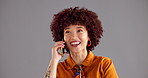 Happy woman, talking and phone call with afro in studio for conversation on a gray background. Female person, model or speaking with smile on mobile smartphone for discussion or chat on mockup space