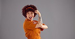 Flex, wink and face of woman in studio for empowerment, strength and confidence. Mockup space, champion and portrait of person with strong, arm or muscle for power, pride and happy on gray background