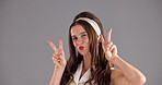 Studio, woman and face with peace sign for beauty, cosmetics and confidence with makeup for model. Mockup space, female person and portrait with pout for eyeshadow, satisfaction and gray background