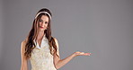 Woman, face and question with hand for promo, advertising or marketing on grey studio background. Portrait, female person and decision for selection, choice and opinion or offer on mockup space