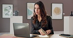 Woman, art director and laptop with book for auction schedule, marketing or sale exhibition. Female person, artist or designer with computer, paintings or ceramic pieces for planning fine exposition