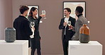 People, toast drinks and happy at art gallery for wine glass, success and celebration for goals. Group, woman and men with curator, champagne and cheers at exhibition, sculpture and sale at event