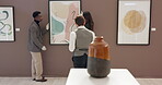 Curator, employees and hang painting in art gallery for exhibition planning, design showcase or auction preparation. Creative, people and tablet for frame guide, teamwork instructions or conversation