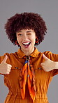 Face, thumbs up and happy woman wink in studio for agreement, feedback or success on gray background. African person, portrait and like hand gesture for victory emoji, peace sign and flirt symbol
