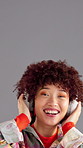Music, headphones and happy woman dance in studio with energy for favorite song on gray background space. African person, face and listening to audio, streaming sound or hip hop playlist on radio