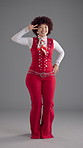 Woman, dancer and vintage fashion in studio with afro, confidence and face for disco party by background. Person, happy and portrait with funky rhythm, excited and retro style for event in Colombia