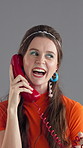 Girl, laugh and retro telephone in studio with chat for story, gossip and disco style by background. Woman, phone call and smile for discussion, contact and happy with comic joke in vintage fashion