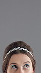 Closeup, eyes and woman in studio, thinking and decision with questions on gray background. Person, mockup space and model with ideas, curious and brainstorming with makeup, confused and solution