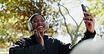 Headphones, fitness and black woman with selfie in park for exercise, workout and training. Nature, relax and happy person take profile picture for social media, internet and online post outdoor