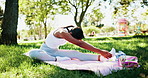 Stretching, yoga and woman on mat in park for workout, exercise and practice for mobility in morning. Nature, mindfulness and person outdoor do pilates for wellness, health and wellbeing on grass
