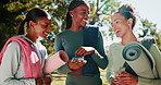 Girl, friends and phone with yoga mat at park with smile, conversation and mobile app with diversity in summer. People, women and smartphone for workout, training or exercise with chat for pilates