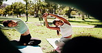 Fitness, yoga and people in park, meditation and wellness with break, exercise goals and relax. Group, yogi and outdoor with friends, nature or zen with chakra, stretching and calm with gratitude