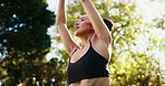 Yoga, praying hands and girl with meditation by park for mindfulness, holistic healing and calm energy. Zen, below and peaceful woman in nature with namaste, wellness and breathing for mental health