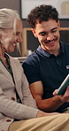 Tablet, happy or senior woman with physiotherapist in home for test results, therapy or medical rehabilitation. Smile, report and elderly patient in retirement with good news for healthcare recovery
