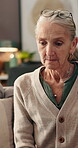 Memory, sadness and thinking with senior woman in retirement home for loss or nostalgia. Depression, emotions and grief with unhappy old person in apartment for loneliness, mistake or regret