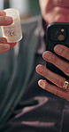 Phone, pills and hands in home to search for medicine label, ingredients or prescription. Mobile, closeup and senior man with drugs for pharma information, healthy dosage and benefits on internet