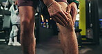 Man, knee pain or injury in gym with muscle tension, cramps or massage with athlete legs for workout. Fracture, inflammation or exercise discomfort with fibromyalgia or strain at fitness center