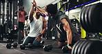 Fitness, men and friends high five in gym for weight lifting target, health goal and rest with dumbbells. Bodybuilder, smile and celebrate for workout at sports club, talking and training success