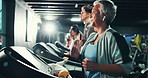 Woman, breathing and earphones on treadmill in gym for fitness, endurance and intense workout with sweating. Training, music and mature female person with machine for exercise, running and cardio