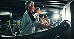 Exercise, music and mature woman on treadmill in gym for cardio training, health or wellness. Earphones, fitness and running with athlete in sports club for challenge, performance or workout